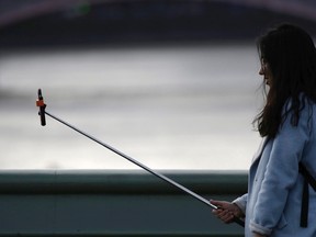 Woman with a selfie stick. 

REUTERS/Kevin Coombs