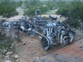 The wreckage of a 1965 Ford sports car is shown in this handout photo provided by Maricopa County Sheriff's Office in Phoenix, Arizona March 3, 2015.  Joseph Wilson, 21, the driver of the car tried to bribe sheriff's deputies in Arizona with a wad of cash after crashing the car in a fiery, rollover collision that killed a 27-year-old woman in the passenger seat, authorities said.  REUTERS/Maricopa County Sheriff's Office/Handout via Reuters