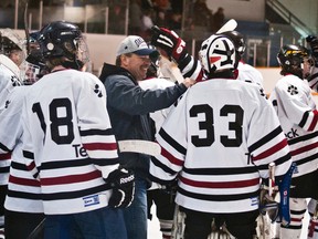 Huskies' coach Kent Goodreau celebrates with goaltender Jeremy Kretz and the rest of the boys from Pincher Creek who will be representing Zone 5 at the Hockey Alberta provincials starting March 19. Greg Cowan photos/Pincher Creek Echo.