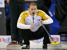 Team Manitoba skip Reid Carruthers calls a shot against Team Newfoundland/Labrador at the Tim Horton's Brier 2015 at the Scotiabank Saddledome in Calgary, Alberta, on  Monday, March 2, 2015. Mike Drew/Calgary Sun/QMI AGENCY