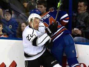 Oscar Klefbom collides with Kings player Trevor Lewis duriong first-period action Tuesday at Rexall Place. (David Bloom, Edmonton Sun)