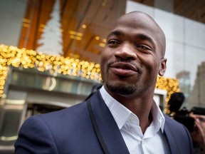 Adrian Peterson exits following his hearing against the NFL over his punishment for child abuse, in New York, in this file photo taken December 2, 2014.  (REUTERS/Brendan McDermid/Files)
