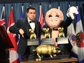 Canadian Taxpayers Federation's federal director Aaron Wudrick poses with the 17th Annual Teddy Government Waste awards in Ottawa on Wednesday, Mar. 4, 2015. (CTF/Handout/QMI Agency)