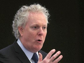 Former Quebec Premier Jean Charest speaks on energy and resources to a luncheon gathering of the Chamber of Commerce in Winnipeg, Man. Wednesday March 4, 2015.