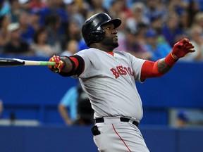 Boston Red Sox designated hitter David Ortiz watches his home run leave the park in the fifth inning against Toronto Blue Jays at Rogers Centre. (Dan Hamilton/USA TODAY Sports)