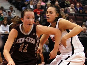 Ottawa Gee-Gees' Kellie Ring, left, scoots past Carleton Ravens' Alyson Bush, right, during the MBNA Capital Hoops Classic Wednesday, Jan. 23, 2013.  QMI Agency