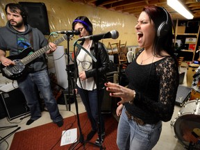London singer WoJo practises for Friday?s London Music Club show with bass player Pat Dal Cin, left, and Emma Phillips, centre. (MORRIS LAMONT, The London Free Press)