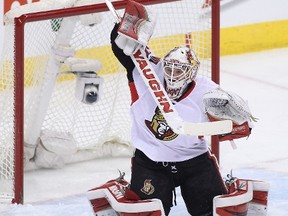 WINNIPEG, MB - MARCH 4: Andrew Hammond #30 of the Ottawa Senators blocks a shot on goal in first-period action in an NHL game against the Winnipeg Jets at the MTS Centre on March 4, 2015 in Winnipeg, Manitoba, Canada.   Marianne Helm/Getty Images/AFP== FOR NEWSPAPERS, INTERNET, TELCOS & TELEVISION USE ONLY ==