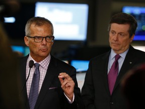 Anthony Haines, president and CEO of Toronto Hydro, left, and Toronto Mayor John Tory speak to the media about power restoration efforts at the Toronto Hydro ops centre on Wednesday March 4, 2015. Jack Boland/Toronto Sun/QMI Agency