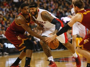 Raptors forward James Johnson (right) tries to go around the Cavaliers’ Tristan Thompson at the ACC last night.  Thompson, from Brampton, went scoreless in 19 minutes. (Dave Thomas/Toronto Sun)