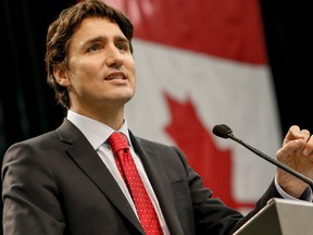 Liberal leader Justin Trudeau, along with Jean Chretien, Hazel McCallion and Eve Adams were on hand at University of Toronto- Mississauga campus, to celebrate the 50th. birthday of the Canadian flag on Sunday February 15, 2015. Dave Thomas/Toronto Sun/QMI Agency