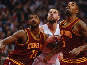 From left, the Cavaliers’ Tristan Thompson, the Raptors’ Jonas Valanciunas and J.R. Smith battle under the basket at the ACC last night. (Dave Thomas/Toronto Sun)