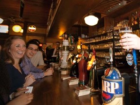 Prime minister Stephen Harper serves beer at the Pub Victoria in Montreal to celebrate Saint Patrick's day, March 16th, 2012.  JOEL LEMAY/AGENCE QMI, file