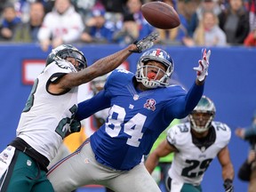 Eagles cornerback Nolan Carroll (23) breaks up a pass intended for Giants tight end Larry Donnell (84) in the end zone during first half NFL action in East Rutherford, N.J., on Dec. 28, 2014. (Robert Deutsch/USA TODAY Sports/Files)