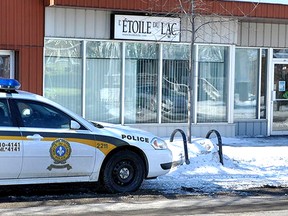 Police car parked outside Infrastructure Minister Denis Lebel's constituency office in Roberval, Que., Thursday, March 5, 2015. (JACQUES BILODEAU/QMI Agency)