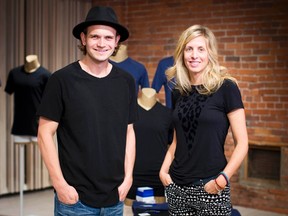 Kit and Ace owners J.J. Wilson and Shannon Wilson pose in their flagship store in Vancouver, British Columbia October 17, 2014. (REUTERS/Ben Nelms)