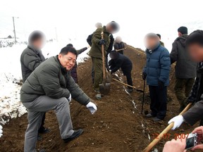 A photo provided by the Light Korean Presbyterian Church on March 5, 2015 shows Reverend Hyeon Soo Lim at an agricultural project in North Korea. (Handout via Reuters)