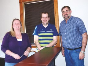 West Elgin Mutual Administrative Assistants, left, Laurie Sura and agents Paul McWilliam and John McWilliam moved into new offices at 195 Currie Rd. in downtown Dutton recently. The company hopes to announce plans soon for a new corporate office.