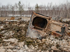 The wreck of a home is all that is left following a fire that claimed two young lives on Makwa Sahgaiehcan First Nation, February 18, 2015. (James Wood/QMI Agency)