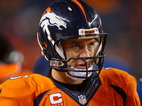 Denver Broncos quarterback Peyton Manning was 'asked' by the Broncos to delete $4 million off his 2015 base salary of $19 million. (Chris Humphreys/USA TODAY Sports)