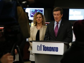 Toronto Mayor John Tory (R) and Councillor Jaye Robinson, chair of the city’s public works and infrastructure committee, address power restoration efforts and fixing water breaks at the Toronto Hydro ops centre on Wednesday March 4, 2015. (Jack Boland/Toronto Sun)