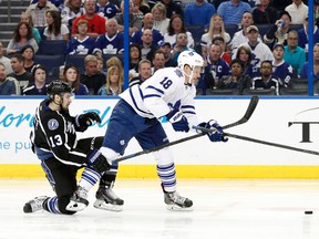 Lightning forward Cedric Paquette tries to slow down Maple Leafs’ Richard Panik on Thursday night at Amalie Arena in Tampa. (USA TODAY SPORTS/PHOTO)
