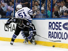 Maple Leafs defenceman Jake Gardiner takes a hit from the Lightning’s Ryan Callahan in the second period in Tampa last night. (USA Today/photo)