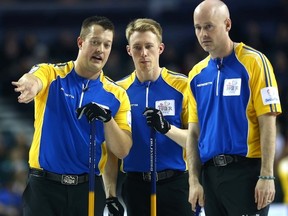 Team Alberta's Ben Hebert has some words during the evening draw Thursday at the 2015 Tim Hortons Brier at the Scotiabank Saddledome in Calgary. (Darren Makowichuk, QMI Agency)