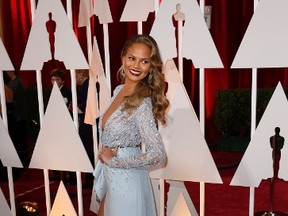 Model Chrissy Teigen, wearing a wearing a light blue bejeweled Zuhair Murad gown, arrives at the 87th Academy Awards in Hollywood, California February 22, 2015. REUTERS/Lucas Jackson
