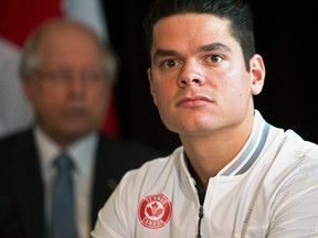 Milos Raonic of Canada looks on at the official draw to determine the match-ups for the Tennis Davis Cup World Group 1 first round at Cecil Green Park House on the UBC campus in Vancouver, British Columbia, March 5, 2015. (REUTERS/Kevin Light)
