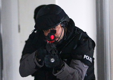 Members of the Peterborough Police Emergency Response Team and K9 Unit conduct a training exercise, Tuesday, March 3, 2015.   Clifford Skarstedt/Peterborough Examiner/QMI Agency