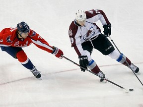 Colorado Avalanche centre Nathan MacKinnon (29) tries to get around Washington Capitals defenceman Matt during NHL play at Verizon Center. (Geoff Burke/USA TODAY Sports)