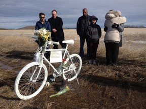 A memorial gathering and ghost bike installation was held Friday for Christopher Beaulieu near the scene of the fatality, on Highway 19 and Range Road 252 at Nisku. Codie McLachlan/Edmonton Sun