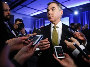 Alberta Premier Jim Prentice speaks to media at a political event in Ottawa March 6, 2015.     REUTERS/Blair Gable