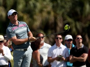 Rory McIlroy of Northern Ireland watches his tee shot on the seventh hole during the second round of the World Golf Championships-Cadillac Championship at Trump National Doral Blue Monster Course on March 6, 2015. (Mike Ehrmann/Getty Images/AFP)