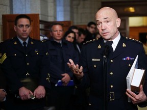 Royal Canadian Mounted Police Commissioner Bob Paulson speaks to media after a public safety committee meeting on Parliament Hill in Ottawa March 6, 2015. Paulson released the video Michael Zehaf-Bibeau made before carrying out his attacks.    REUTERS/Blair Gab