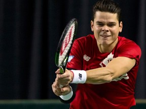 Canada's Milos Raonic hits a return to Japan's Tatsuma Ito during their Davis Cup match at the Doug Mitchell Thunderbird Sports Centre in Vancouver March 6, 2015. (REUTERS/Kevin Light)