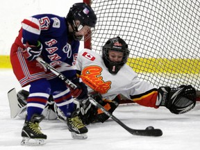 The North York Rangers (in blue) battle the Elgin Middlesex Chiefs at the Bell Capital Cup. (QMI Agency file)