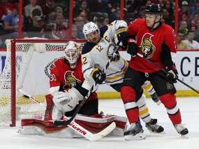 Ottawa Senators goalie Andrew Hammond makes a stick save against the Buffalo Sabres during second period action at the Canadian Tire Centre in Ottawa Friday March 6, 2015.   Tony Caldwell/Ottawa Sun/QMI Agency