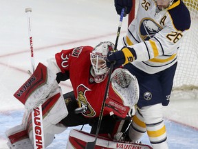 Ottawa Senators goalie Andrew Hammond tries to get position on Matt Moulson from the Buffalo Sabres during the first period at the Canadian Tire Centre in Ottawa Friday March 6, 2015.   Tony Caldwell/Ottawa Sun/QMI Agency