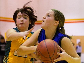 Ashley Cooper, of Glen Cairn, defends against Kristen Bisschop, of Northdale Central, during a girls game at the TVDSB elementary basketball championships, being held this weekend at several London high schools. (MIKE HENSEN, The London Free Press)