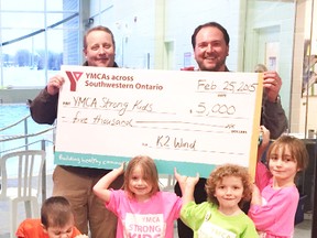 The Goderich-Huron YMCA received a $5,000 Strong Kids Campaign donation from K2 Wind. Back row, left to right: Robin Maxwell, operations manager K2 Wind and Paul McInnis, general manager, Goderich-Huron YMCA. Kids in front row, left to right: Harrison Harp, Emily Hoy, Norman Hoy and Lincoln Henry. (Contributed photo)
