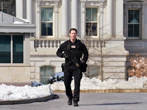 A Secret Service agent tells the press to return to the press room prior to U.S. President Barack Obama and First Lady Michelle Obama's departure from the White House in Washington, for a day trip to Selma, Alabama, March 7, 2015.  A White House lockdown triggered by a loud noise on Saturday morning is now contained and there is no serious threat, media reports said. The incident disrupted Obama's departure plans. Obama is visiting Selma to commemorate the 50th anniversary of "Bloody Sunday", which sparked the 1965 Voting Rights Act. REUTERS/Mike Theiler