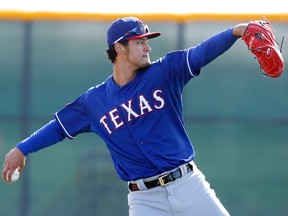 Texas Rangers pitcher Yu Darvish warms up during spring training at Surprise Stadium in Arizona. (Rick Scuteri/USA TODAY Sports)
