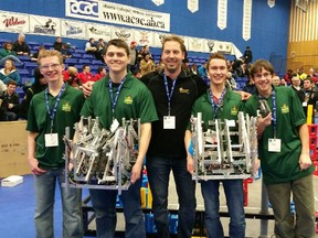 The team, Aaron Simons, Carl Toney, teacher Neil Lindstrom, Dustin Wagner and McGinnis were proud of their machines at the regional qualifiers in Edmonton over the Family Day long weekend. The group did not make it to the finals, but did earn their invitation to B.C. - Photo Supplied