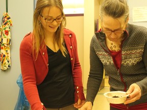 Lisa Delwo (left) and Marie-Michele Benoit worked together to identify seven types of soil by feeling how moist they were and how they smelled during a soil testing class at the Multicultural Heritage Centre in Stony Plain on Feb. 25. For more information on the Organic Master Gardener program, visit www.multicentre.org. - Karen Haynes, Reporter/Examiner