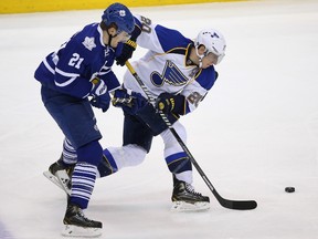 St. Louis Blues left wing Alexander Steen (20) skates with the puck as he is pursued by Toronto Maple Leafs left wing James van Riemsdyk (21) at Air Canada Centre on March 25, 2014. The Blues beat the Maple Leafs 5-3.(Tom Szczerbowski-USA TODAY Sports)