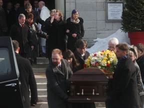 Pallbearers carry the body of World War II veteran Ernest Cote from Notre Dame Cathedral on Saturday, March 7, 2015 following his funeral service. Hundreds of people and family members attended the funeral to pay their respects to the 101 year old veteran. Cote, who landed on Juno Beach during D-Day, had also survived a brutal home invasion and robbery back in December.  
Tony Caldwell/Ottawa Sun/QMI Agency