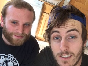 Students from St. Cloud University in Minnesota, Ryan Brandenburg (left) and Quentin Super, are riding about 800 miles over eight days from Minnesota to Winnipeg and home again.
