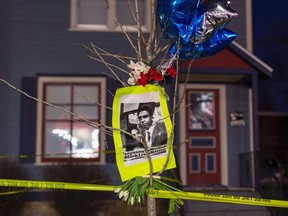 A makeshift memorial pays tribute to a 19-year-old black man killed by police, in front of a home cordoned off with barricade tape on Williamson Street in Madison, Wisconsin March 7, 2015. Demonstrators marched on Saturday to protest the police killing of the man, identified by the Dane County Medical Examiner's Office as Tony T. Robinson Jr., in Madison, Wisconsin, an incident that came amid growing scrutiny of U.S. law enforcement's use of lethal force against minorities, the poor and mentally ill. (REUTERS/Tom Lynn)